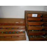 Two wooden chests housing watchmakers spare parts