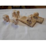 Five carved elephants teeth in the form of elephants