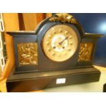 A large Victorian slate mantel clock the brass and enamel dial with Roman numerals and inscribed