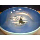 An unusual large Royal Doulton blue and green glazed bowl the interior hand-painted with a sailing
