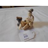 A Chinese erotic carved ivory decorated couple entwined, signed to base   Male damaged