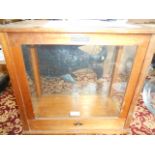 A glazed mahogany Apothecary scales cabinet with sliding doors to front