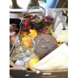 A box of assorted scented candles and candle holders