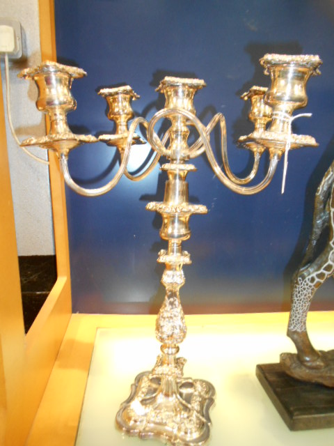 A large ornate rococo style silver plated five branch candelabra