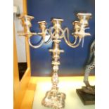 A large ornate rococo style silver plated five branch candelabra