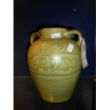 A T W Lemon Wesuma art pottery green glazed twin handled vase of ovoid form decorated with flowers