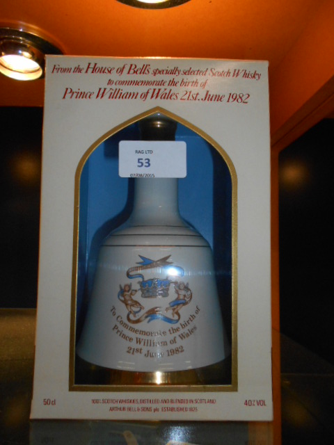 An unopened bottle of Bells Whiskey to commemorate the birth of Prince William of Wales,