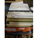 A large collection of sheet music in three boxes