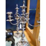 A pair of Sheffield silver-plated three branch candelabra with scroll and acanthus embossed