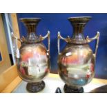 A pair of large twin-handled vases with central figural scenes,