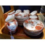 A quantity of red and white Oriental eggshell porcelain tea ware