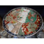 A large 19th C Oriental charger with hand painted decoration,