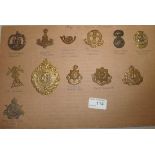 Sheet of 12 regimental cap badges inc Ar