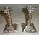 Pair of silver hallmarked dwarf candlesticks on stepped bases (5.5" high) London 1903