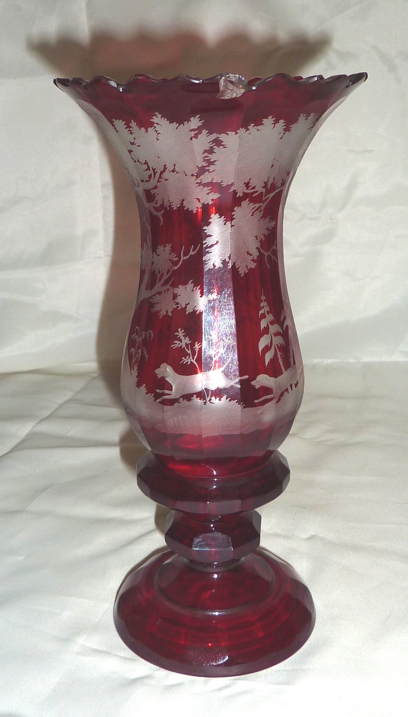Bohemian ruby red vase with etched detail of stag being chased by hunting dogs in wooded scene