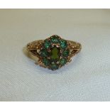 Boxed 9ct gold and peridot flower head ring
