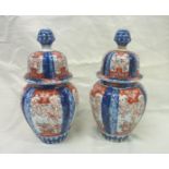 Pair of Imari style vases with covers (a/f) (24cm high)