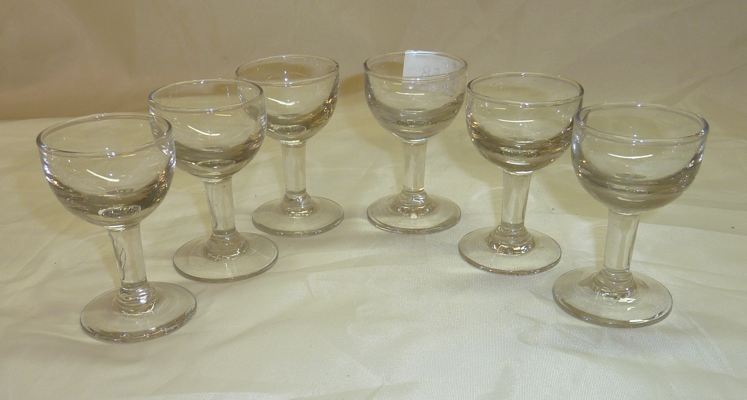 Set of six 19th/20th C penny lick glasses