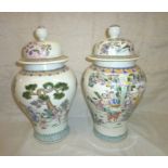 Pair of Chinese vases stylized with various figures, foliage and deer with 6 digit signature panel