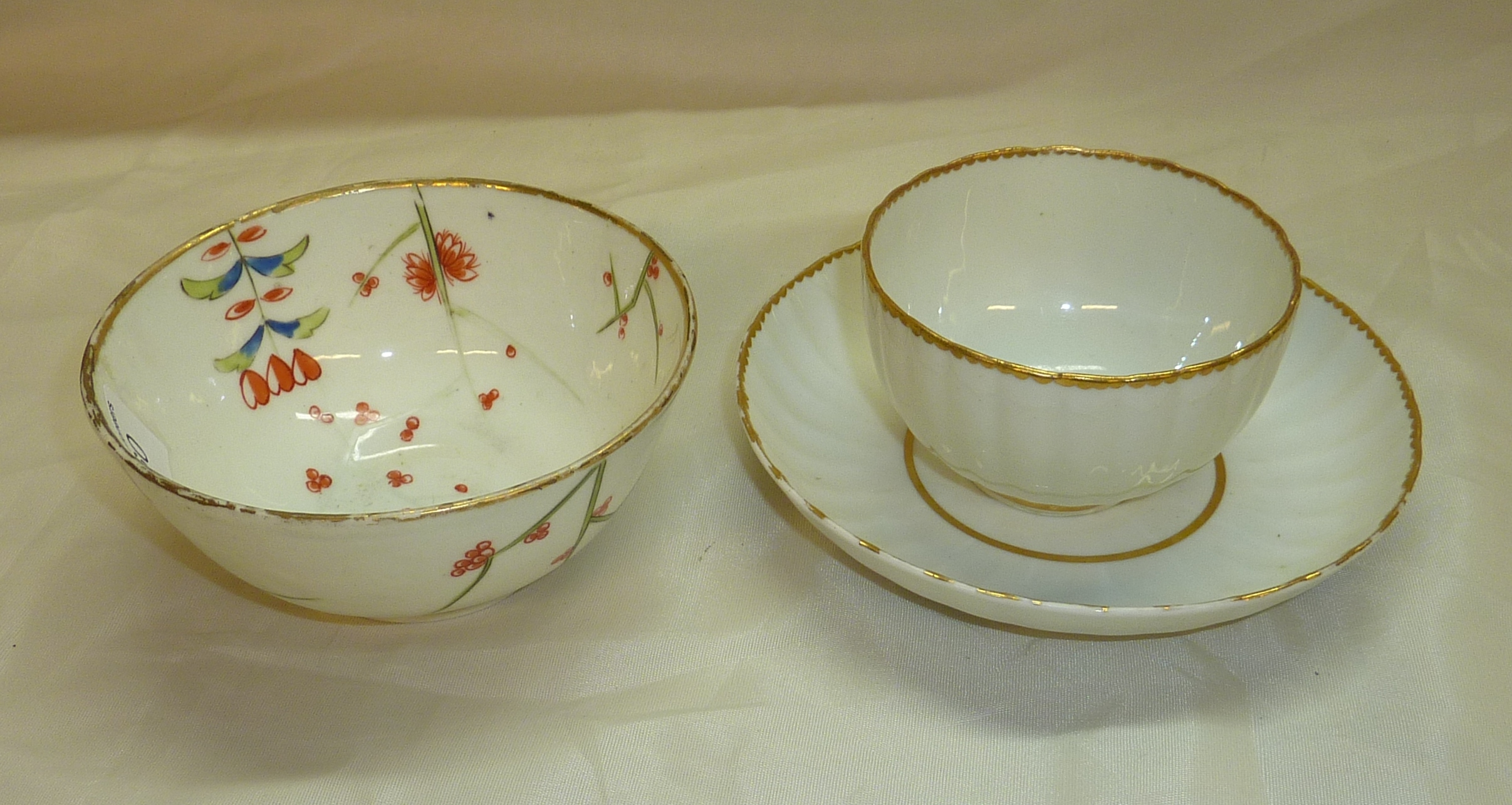 Crown Derby tea bowl with Oriental style floral detail and another C1820 tea bowl and saucer (3)