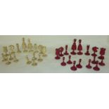 Early 20thC bone chess set with red stai