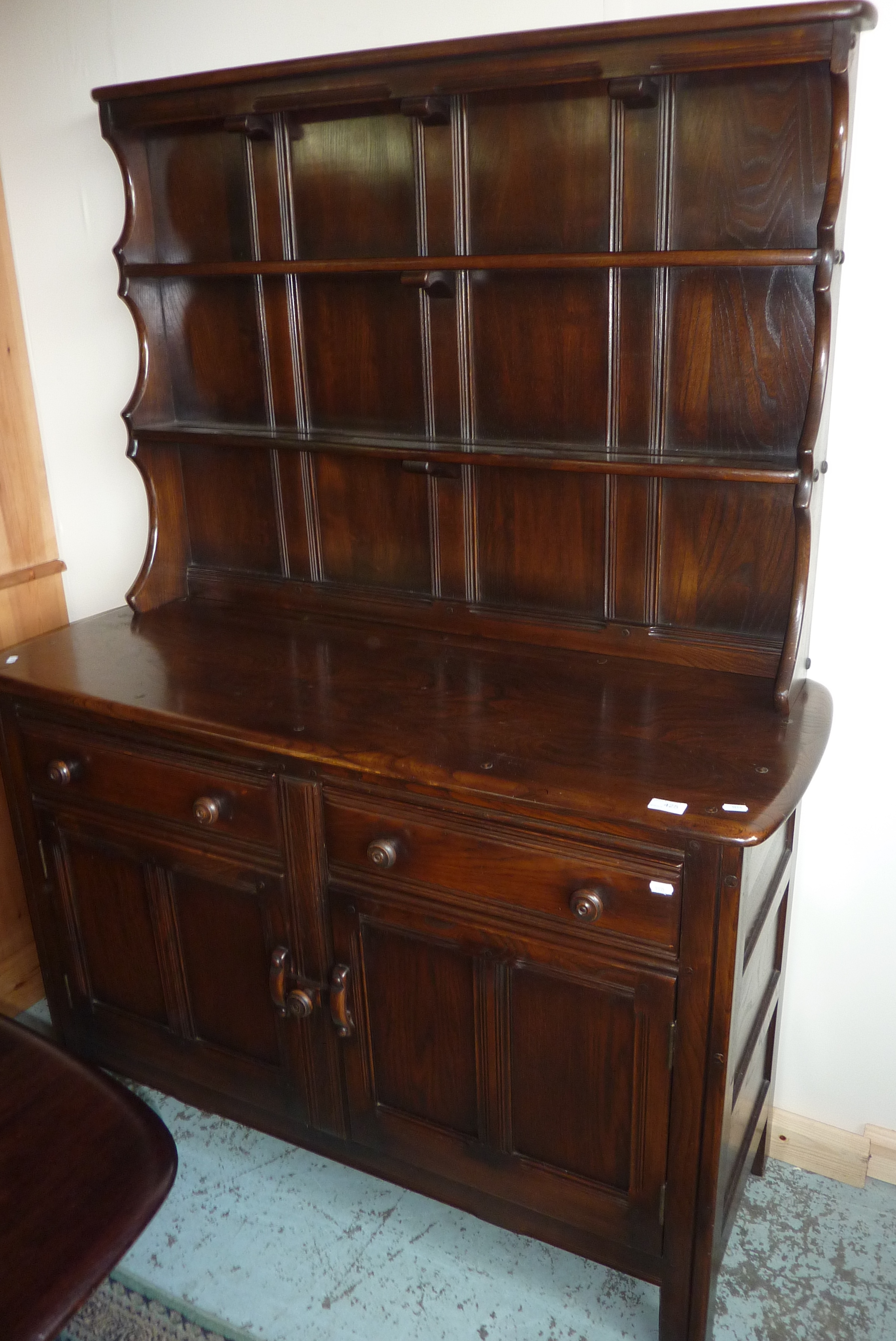Ercol darkwood dresser with 2 tier raised back above 2 drawers and 2 cupboard doors