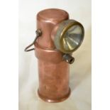 Copper cased CEAG Miner's Supply Co Ltd type BE3 hand lamp stamped Barnsley with crows foot mark