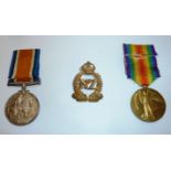 WWI pair comprising of British war medal and victory medal along with New Zealand cap badge awarded