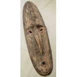 Late 19thC New Guinea carved wood mask,