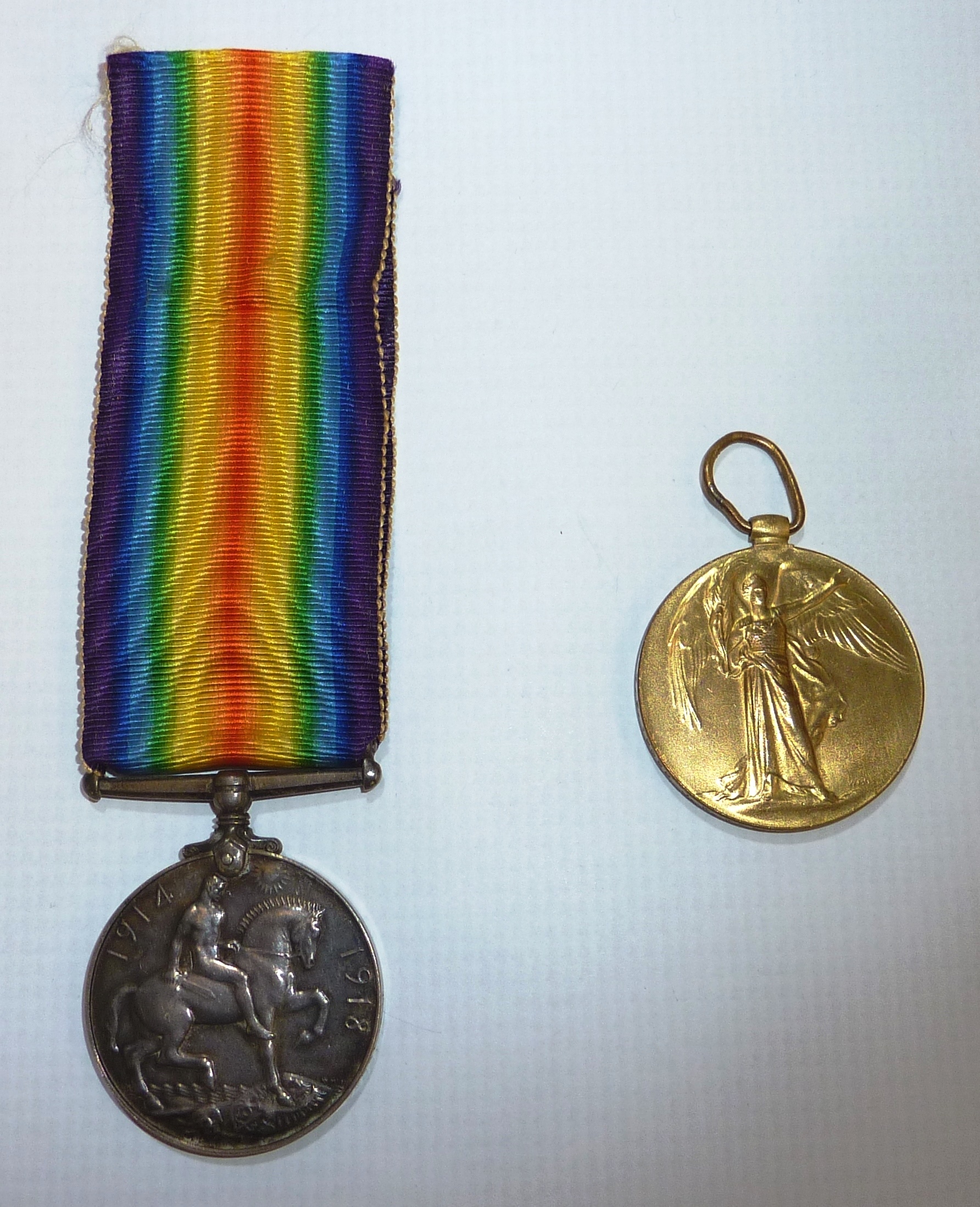 WWI pair comprising of British war medal and victory medal awarded to 'T.Z.12032 J.W.WHITE O.TEL R.