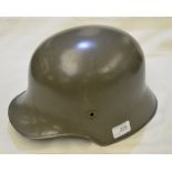 German steel helmet in a painted green f