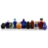 A collection of eleven various Chinese glass snuff bottles including simulated agate & overlay