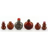 A group of six various Chinese glass snuff bottles including a pair of double gourd snuff bottles