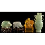 A group of four Chinese items including a carved jadeite model of an elephant, 4ins. (10.2cms.)