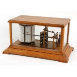 Property of a gentleman - an early C20th oak cased barograph, the case 14.45ins. (36.7cms.) long (