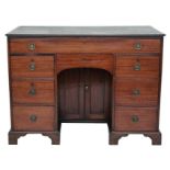 Property of a gentleman - a George III mahogany kneehole desk, circa 1800, with inset leather top