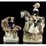 Property of a gentleman - two Victorian Staffordshire figures, the first modelled as a lady on a