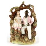 Property of a deceased estate - a Victorian Staffordshire negro arbour group depicting Uncle Tom &