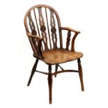 Property of a gentleman - an early C19th yew wood Windsor elbow chair, of good colour, attributed to