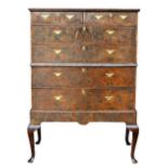 Property of a lady - an early C18th walnut or mulberry & featherbanded two-part chest of two short &