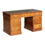 Property of a lady - a late C19th / early C20th oak twin pedestal desk, with green leather inset top