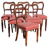 A set of six early Victorian rosewood dining chairs, circa 1850, with turned tulip decorated front
