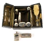 Property of a gentleman - an early C20th dark green morocco leather vanity case with silver