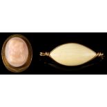 Property of a lady - a pale pink coral oval brooch, carved in relief with the head of a maiden, 1.