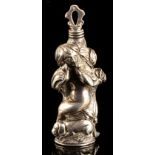 An unmarked Continental silver scent bottle, probably C19th, modelled as a figure holding two doves,