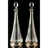 Property of a gentleman - a pair of French silver mounted clear glass decanters, of tapering