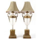 Property of a gentleman - a large pair of gilt metal or brass mounted cut glass table lamps,