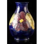 Property of a lady - a Moorcroft Clematis pattern baluster vase, impressed 'MOORCROFT' with