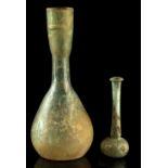 Property of a lady - antiquities - two Roman glass bottles, both with iridescence, the taller 7.