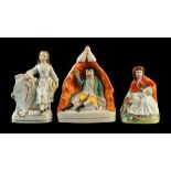 Property of a lady - three Victorian Staffordshire figures including a figure of a girl with kite,